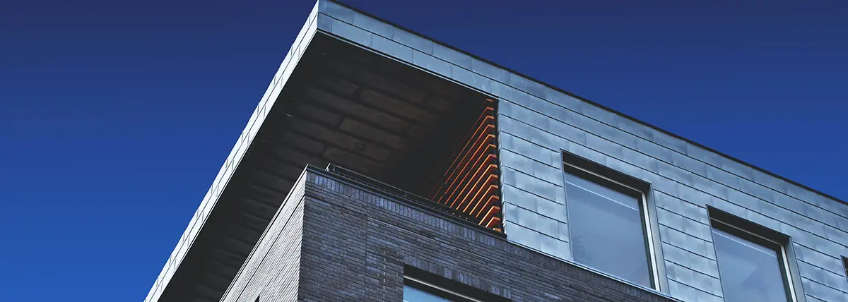 the top corner apartment of a brick building
