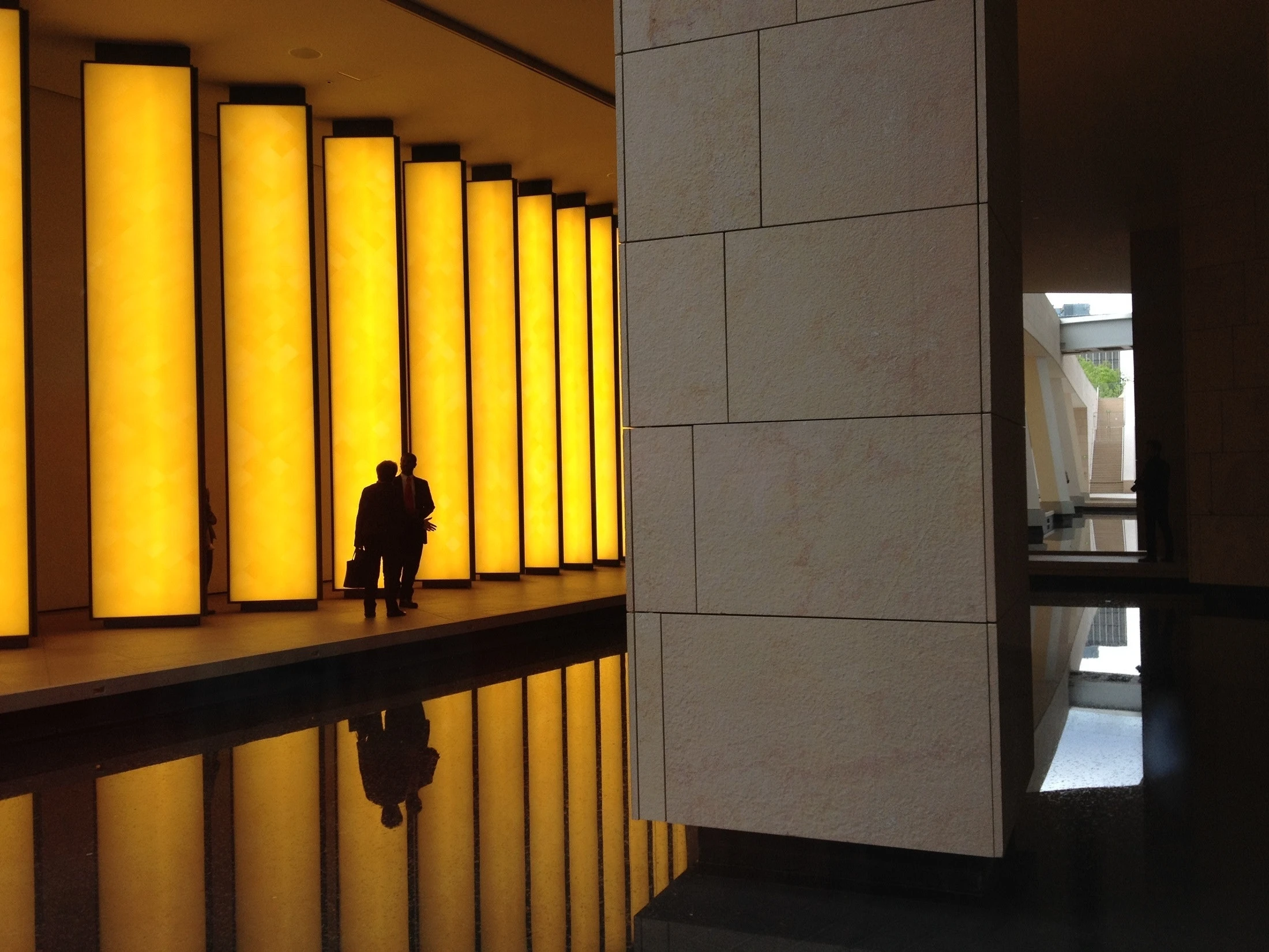 photo of two people in the hallway of an office building